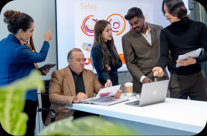 Team discussing workforce plans in front of a presentation