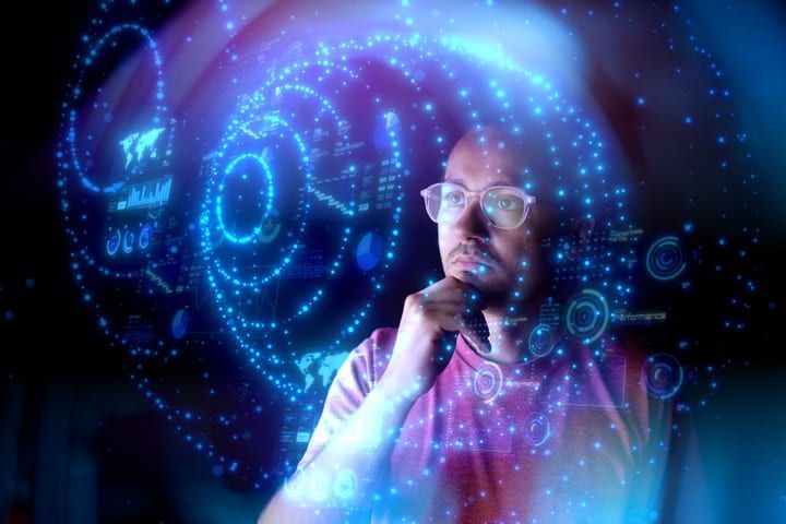 Engineer surrounded by projected AI data visualisations