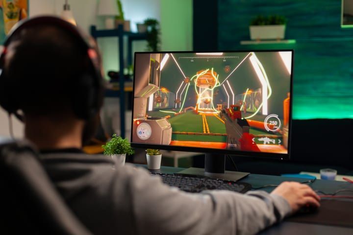 Player using a gaming setup with headphones